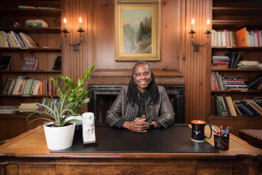 Robin Holmes-Sullivan at a desk in the Frank Manor House