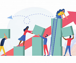 Composition with group of multiracial employees, managers or office workers moving boxes to assemble towers. Concept of teamwork, team bu...