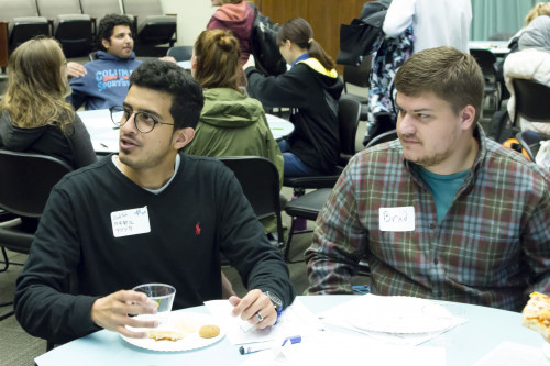 Students work on activities together during the Conversation Partners Launch Party.