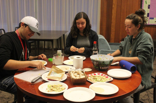 Students in Platt-Howard help make potstickers with the TCK Club.