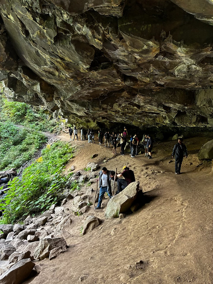 Students hiking Horsetail Falls in the Columbia Gorge on Day 4 of the HWI Youth Wellness Camp, pictured as we walked beneath the waterfal...