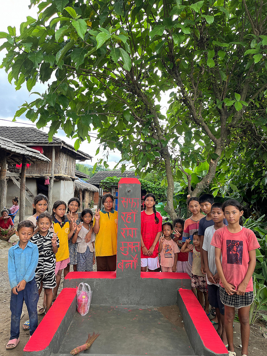 Children coming together to write slogans in the newly built communal taps.