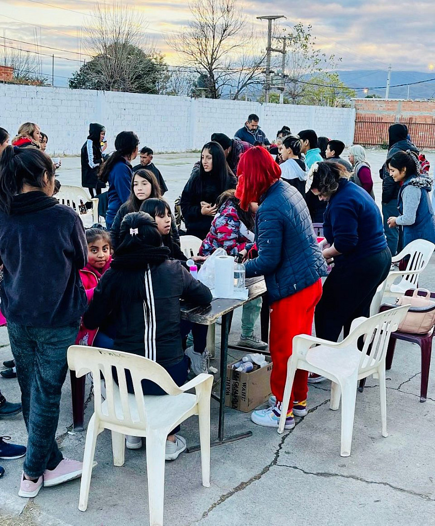 Children playing around a table at Snack House. Salta, Argentina.