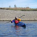 Two kayakers practice maneuvers