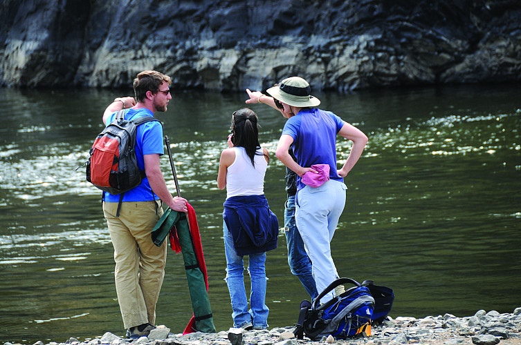 Associate Professor Elizabeth Safran and members of her field research team look toward a terrace mantled with boulders. The rocks were m...