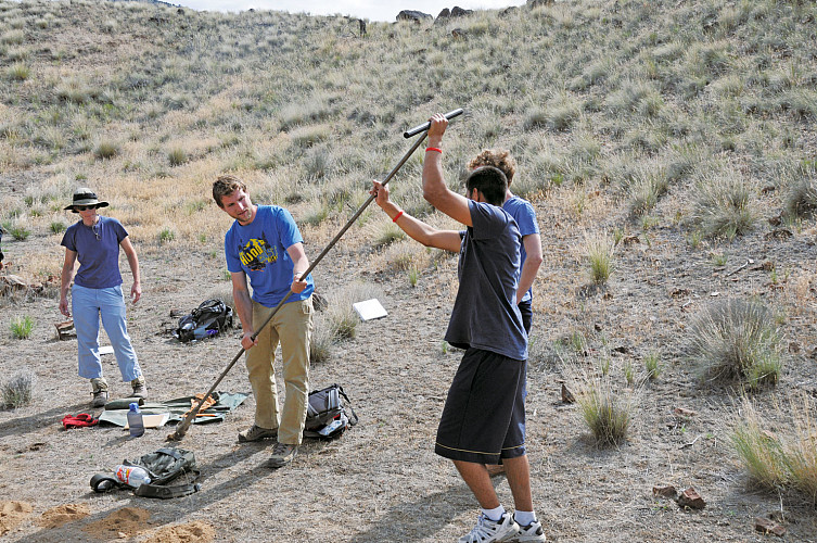 Associate Professor Liz Safran, Martin Meyer BA '09, high school student Aaron Romero, and Travis Walton CAS '10 use an auger to obtain...