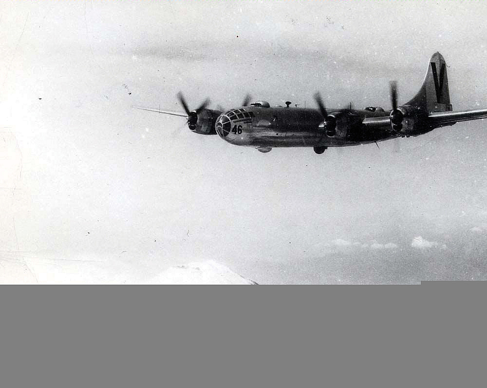 An American B-29 bomber flies over Mount Fuji (1945). (Credit: U.S. Army Air Forces, Wikimedia Commons)