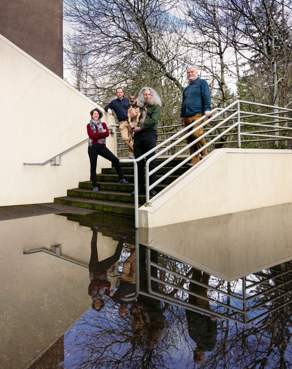 The faculty team (from left): Professors Liz Safran, Bryan Sebok, Peter Drake and his dog, Violet, and Erik Nilsen.