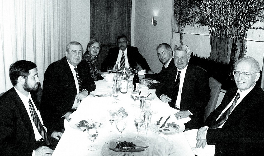 Russia's minister of atomic energy, Aleksandr Rumyantsev (second from left), at a 2002 dinner for Thomas Neff (second from right). Rumyan...