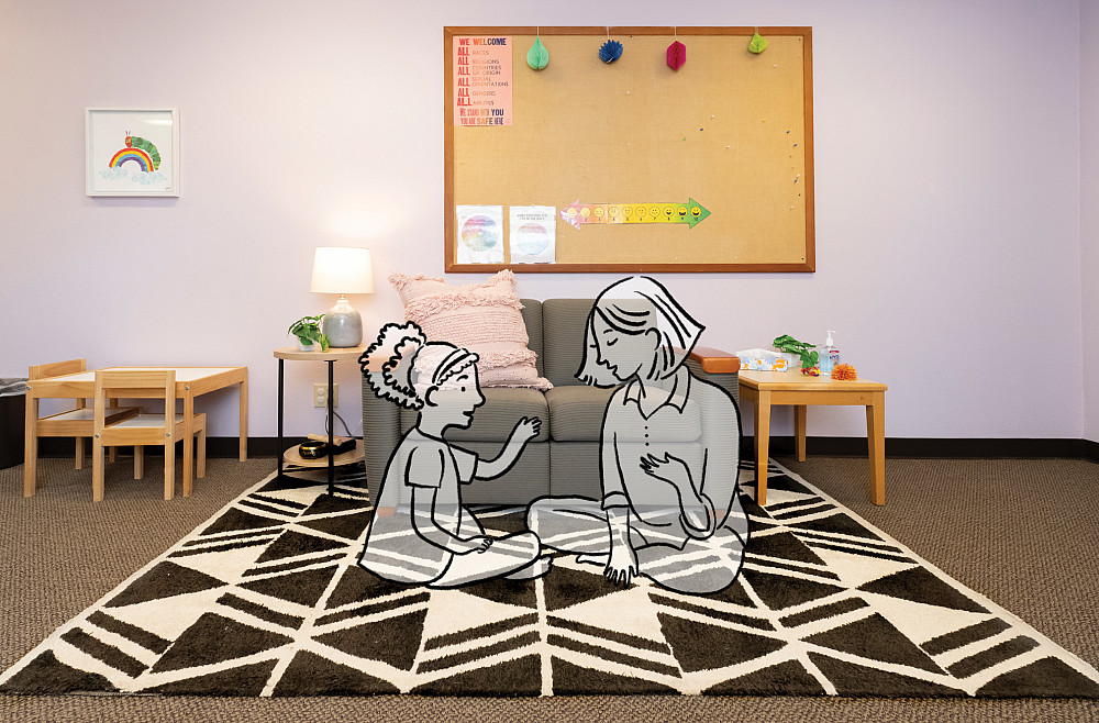 Counseling students work with children in a specially equipped treatment room.