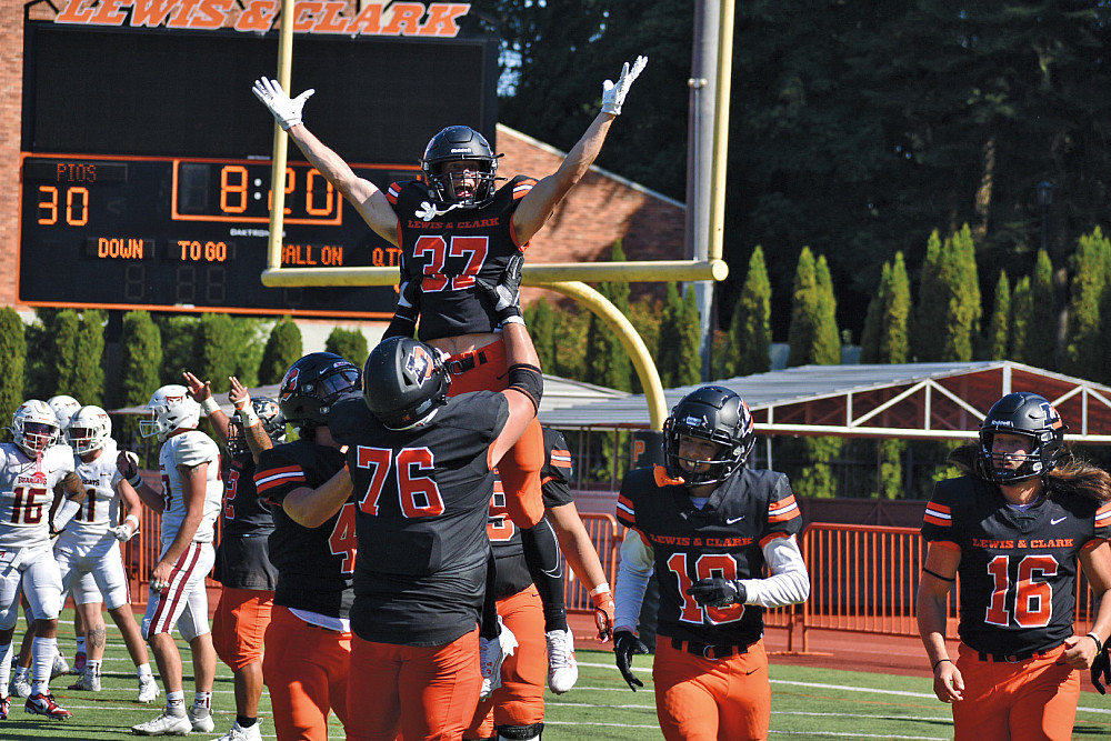 Jordan Lahusky BA '26 celebrates scoring a touchdown.