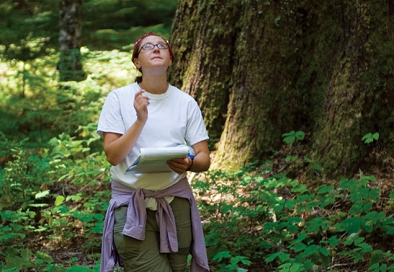Nora Moore '10 assesses a tree's cause of death.