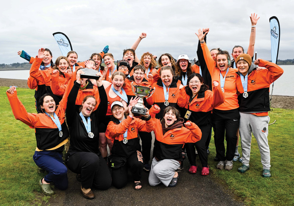 Women's rowing celebrates after winning their first NWC Title in program history.