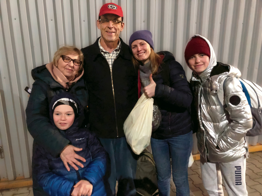 The Teskeys meet the family in Warsaw. Below: 6-year-old Bohdan, Olga Pechinka, Mike Teskey BA '85, Olga Zakrevska, and 14-year-old Milana.