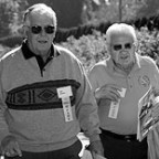 Above: Rod Downey '50 and a classmate (who's covering his nametag!) head to the tailgate party. Below: Catherine Brookins Schweitzer '92 ...
