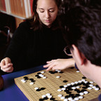 Above: Amanda Venghaus '04 plots her next move against Peter Drake, assistant professor of computer science.