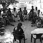 Satya Byock '04 leads a discussion about how to help Komari's farmers.