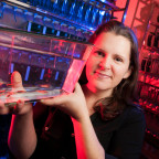 Weissman-Unni holds a small tank of zebrafish. Weissman-Unni's neurobiology training focused on mammalian systems, but she chose to shift...