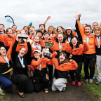 Women's rowing celebrates after winning their first NWC Title in program history.