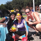 Kallie Kurtz (far right) works with teens painting a street mural for peace.