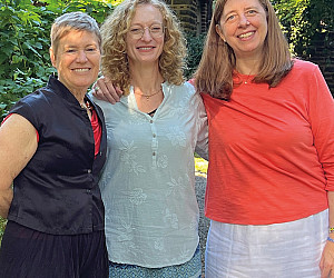 New director Katie Jo Walter BA '09 (center), joined by Ginger Moshofsky BA '83 (left) and Emily Decker BA '85 outside the Alumni Gatehouse.