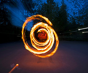 Sri Sundaresan BA '27 creates a mesmerizing arc of fire during a practice session of Fire Arts, one of L&C's 100-plus stude...
