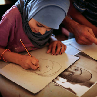 A young artist in the Zaatari  refugee camp, Jordan