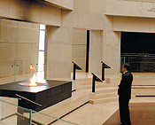 Levinger pauses for a moment of contemplation in the Hall of Remembrance at the Holocaust Museum.