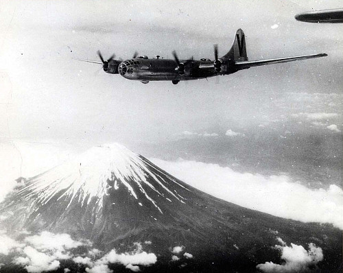 An American B-29 bomber flies over Mount Fuji (1945). (Credit: U.S. Army Air Forces, Wikimedia Commons)