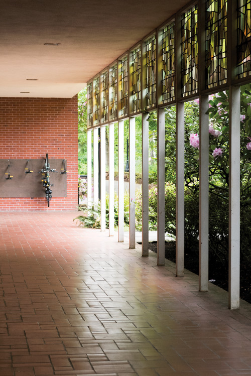 A hallway and a bike on a rack in the York building at the graduate school.