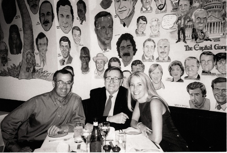 Cat Mulhall '99 with news analysts David Brooks (left) and Mark Shields of NewsHour.