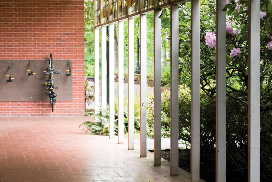 A hallway and a bike on a rack in the York building at the graduate school.