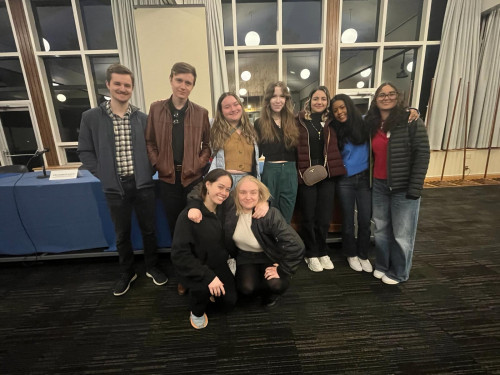 2023-2024 TCK Board at the Symposium. From left to right, (top) Trevor Jackson, Ethan Vanderende, Savannah Bishop (FA2023 Intern), Tessa ...