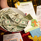 Photo of a bowl full of dollars.