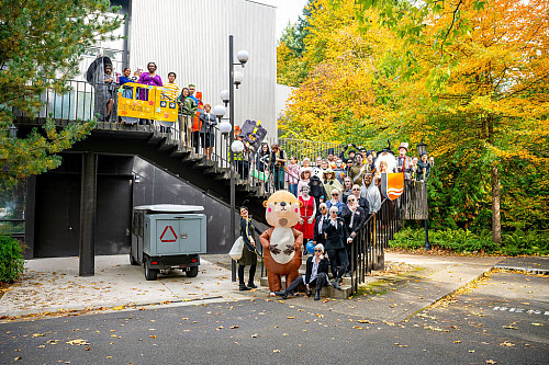 The 2025 Halloween costume parade posed for a photo on the Fowler staircase.