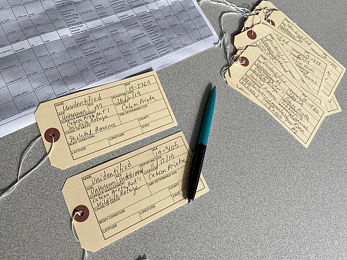 Filling out toe tags for Hostile Terrain 94 event.