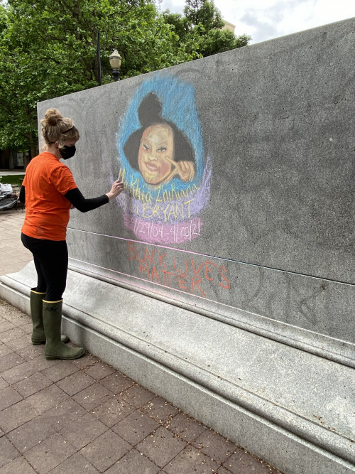 LC Art for Social Change members Mary Andrus, Liv Siulagi, Lawrence Siulagi and Beth Ann Short draw with colored chalk at Shemanski Park ...