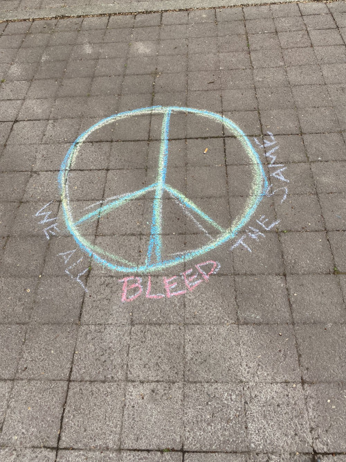 LC Art for Social Change members Mary Andrus, Liv Siulagi, Lawrence Siulagi and Beth Ann Short draw with colored chalk at Shemanski Park ...