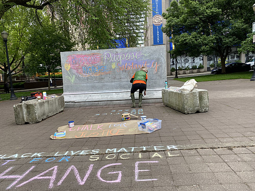 LC Art for Social Change members Mary Andrus, Liv Siulagi, Lawrence Siulagi and Beth Ann Short draw with colored chalk at Shemanski Park ...