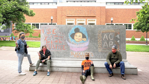 LC Art for Social Change members Mary Andrus, Liv Siulagi, Lawrence Siulagi and Beth Ann Short draw with colored chalk at Shemanski Park ...