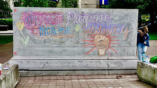 LC Art for Social Change members Mary Andrus, Liv Siulagi, Lawrence Siulagi and Beth Ann Short draw with colored chalk at Shemanski Park ...