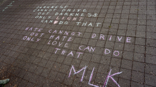 LC Art for Social Change members Mary Andrus, Liv Siulagi, Lawrence Siulagi and Beth Ann Short draw with colored chalk at Shemanski Park ...