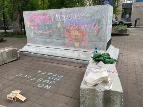 LC Art for Social Change members Mary Andrus, Liv Siulagi, Lawrence Siulagi and Beth Ann Short draw with colored chalk at Shemanski Park ...