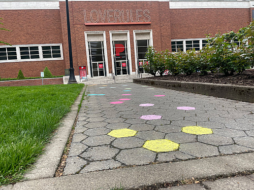 LC Art for Social Change members Mary Andrus, Liv Siulagi, Lawrence Siulagi and Beth Ann Short draw with colored chalk at Shemanski Park ...