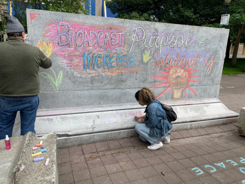 LC Art for Social Change members Mary Andrus, Liv Siulagi, Lawrence Siulagi and Beth Ann Short draw with colored chalk at Shemanski Park ...