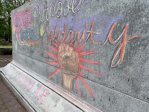 LC Art for Social Change members Mary Andrus, Liv Siulagi, Lawrence Siulagi and Beth Ann Short draw with colored chalk at Shemanski Park ...