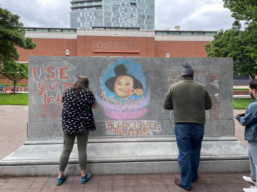 LC Art for Social Change members Mary Andrus, Liv Siulagi, Lawrence Siulagi and Beth Ann Short draw with colored chalk at Shemanski Park ...