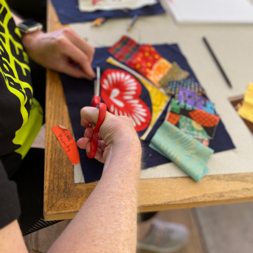 Mary Andrus planning out a quilt square design.