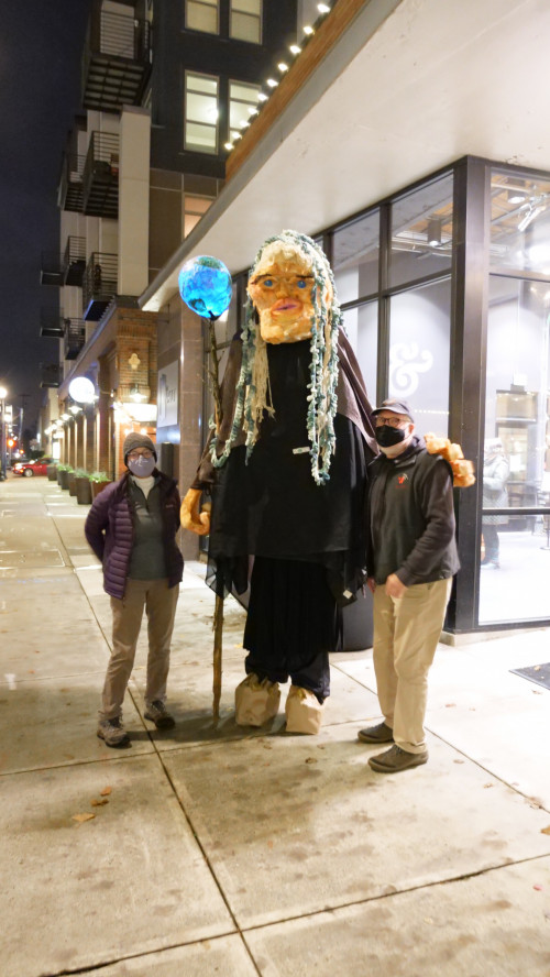 Mary Andrus (in Mother Earth costume), co-chair of Art for Social Change with audience members.