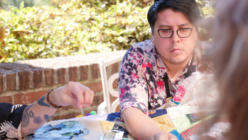 Members of Art for Social Change met to work on the Pandemic Quilt